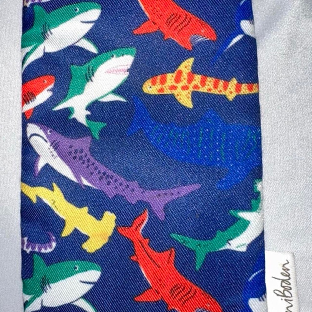 Mini Boden shark print eye glass holder multicolored sharks on a blue background
